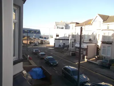 a view from a window of a street with parked cars at Holmeleigh Hotel in Blackpool