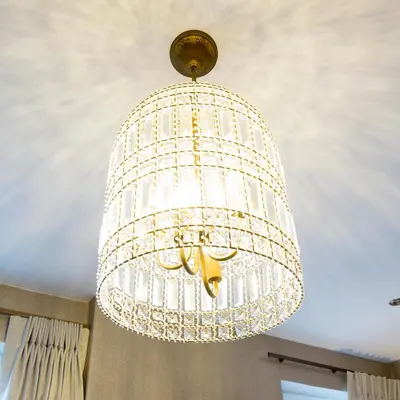 a large white chandelier hanging from a ceiling at Arthur's Bar & Accommodation in Southport