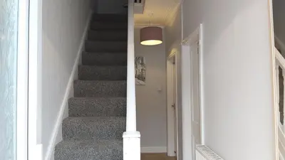a staircase in a house with a stair case at Talton House in Liverpool