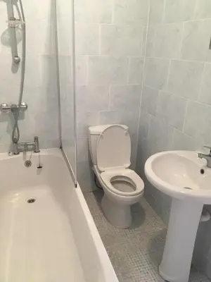 a bathroom with a toilet and a sink at MARLEY MANSIONS APARTMENT - Clarendon in Wallasey