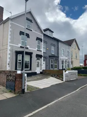 a house on the side of a street at MARLEY MANSIONS APARTMENT - Clarendon in Wallasey