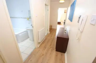 a bathroom with a sink and a phone on the wall at MARLEY MANSIONs APARTMENTS - KING ST REF : 10/3 in Wallasey
