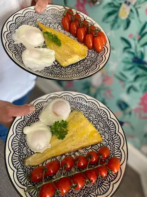two plates of food with tomatoes on a table at Sunnyside Guest House Southport - winner of Best B&B in the country 2025-26 in Southport