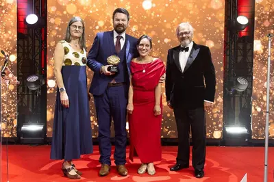 a group of people posing for a picture on a red carpet at Sunnyside Guest House Southport - winner of Best B&B in the country 2025-26 in Southport