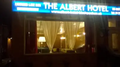 a sign for the albent hotel in a hotel room at The Albert Hotel Near Winter Gardens in Blackpool
