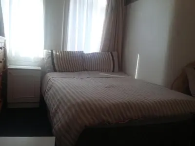 a small bed in a room with a window at The Midway in Blackpool