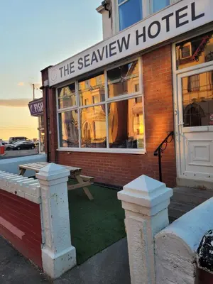 a building with a sign that reads the savoy hotel at MyRoomz Seaview Hotel in Blackpool