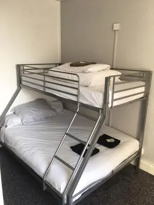 a couple of bunk beds in a room at MyRoomz Seaview Hotel in Blackpool