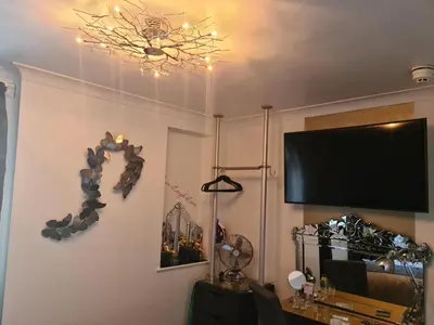 a living room with a flat screen tv on the wall at The Arthington in Blackpool