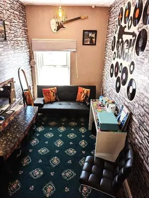 a living room with a couch and a table at The Mercury in Blackpool