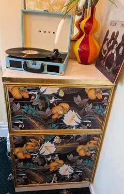 a wooden dresser with a briefcase on top of it at The Mercury in Blackpool