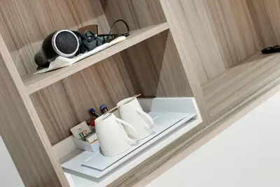 a cupboard with two rolls of toilet paper at The Podworks Hotel in Liverpool