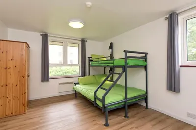 a room with a green bunk bed in it at YHA Liverpool Albert Dock in Liverpool