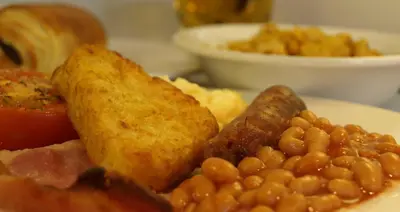 a plate of breakfast food with beans and toast at YHA Liverpool Albert Dock in Liverpool