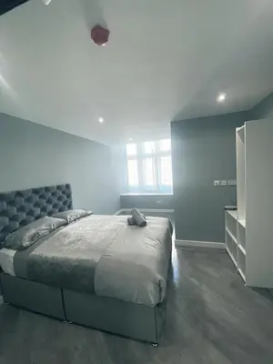 a bedroom with a large bed in a room at Brownlows Inn in Liverpool