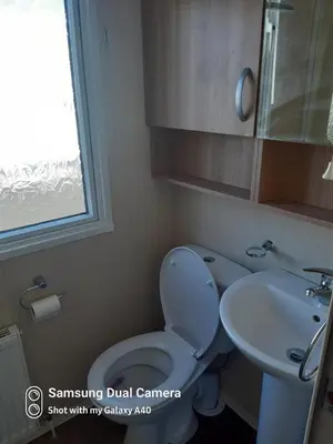 a bathroom with a toilet and a sink at Family Holidays Blackpool in Blackpool