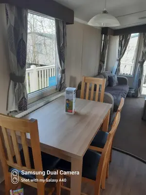 a table in a caravan with a box on it at Family Holidays Blackpool in Blackpool