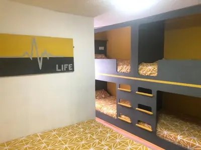 a room with two bunk beds in a room at The Elk in Blackpool