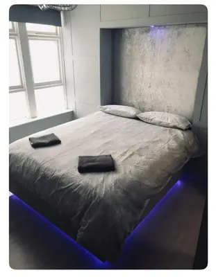 a bedroom with a bed with two towels on it at The Elk in Blackpool