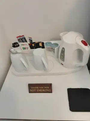 a counter with a tea pot and cups on it at The Cardoun in Blackpool