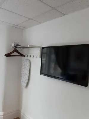 a flat screen tv hanging on a wall at The Cardoun in Blackpool