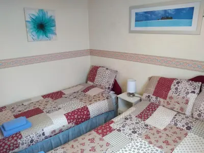a bedroom with two beds with quilts on them at Southview Hotel in Blackpool