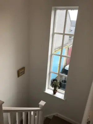 a window in a white room with a plant at 4 Laurel Court in Ulverston