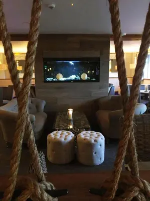 a living room with a couch and a table at The Dunes Hotel in Barrow in Furness