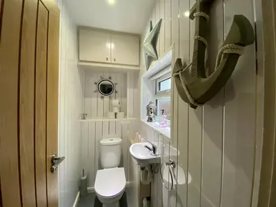 a small bathroom with a toilet and a sink at Kennedy House by Blackpool Service Apartments in Blackpool