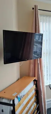 a flat screen tv hanging on a wall at The Sanderling in Morecambe
