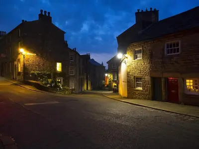 an empty street in an old town at night at Castle View in Lancaster