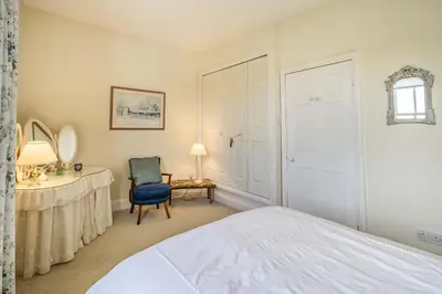a bedroom with a bed and a desk and a chair at 2 Beacon High in Lindale