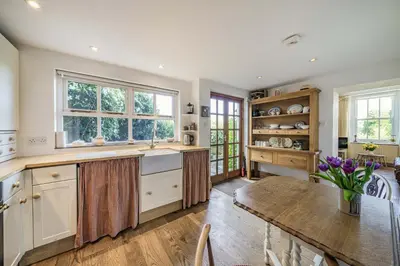 a kitchen with a table and a dining room at 2 Beacon High in Lindale