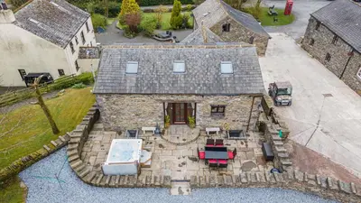 an aerial view of a house with a roof at Hill Side Barn in Ireleth