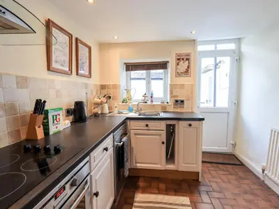 a kitchen with a sink and a counter top at 4 Greencross Cottages in Holme