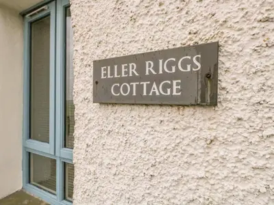 a sign on the side of a building at Eller Riggs Cottage in Ulverston