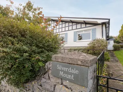a house with a sign in front of it at Silverdale Mount in Grange Over Sands