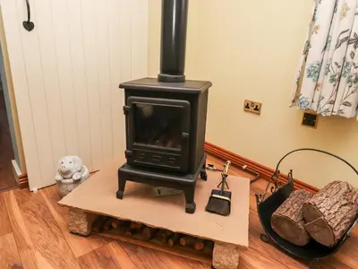 a stove sitting on a table in a room at Deekswood in Pilling
