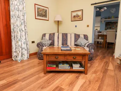 a living room with a couch and a coffee table at Deekswood in Pilling