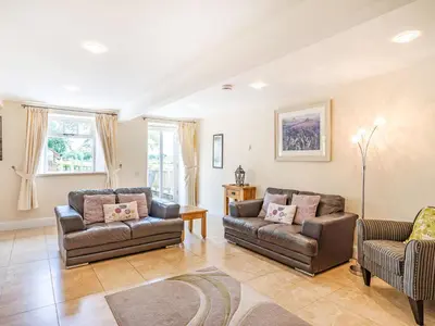 a living room with two couches and a couch at Hay Barn in Burton in Lonsdale