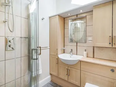 a bathroom with a sink and a shower at Hay Barn in Burton in Lonsdale