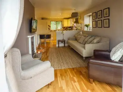 a living room with two couches and a couch at Bridleway Cottage in Wennington