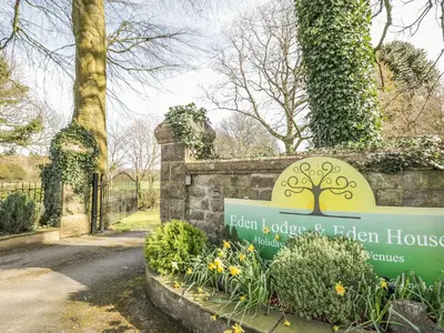 a sign for the henley jolie and eden house at Eden Lodge in Bardsea