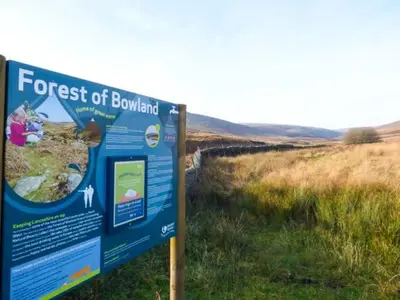 a sign for the forest of bowland in a field at 88 Regent Street in Waddington