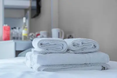 a stack of towels sitting on top of a counter at Central Station Hotel Liverpool in Liverpool