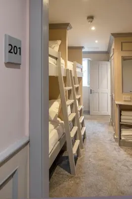 a room with a bunch of bunk beds at Central Station Hotel Liverpool in Liverpool