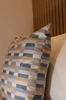 a pillow sitting on top of a bed at Craig-y-Don in Blackpool