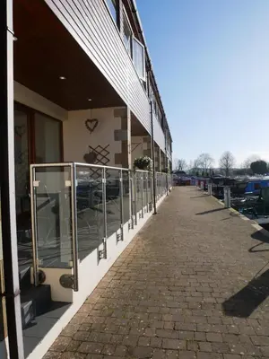 a building with a walkway next to a building at 8 Swan House in Carnforth