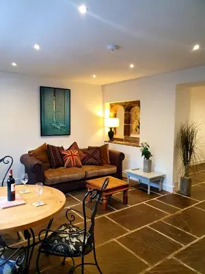 a living room with a couch and a table at The Priory in Scorton