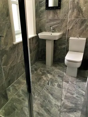 a bathroom with a toilet and a sink at Woodlands Holiday Apartments in Lytham St Annes